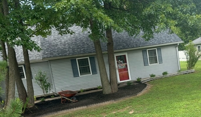 Completed lawn service — trimmed and maintained property