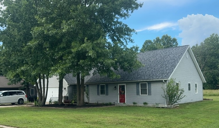 Lawn after cleanup and landscaping work — polished and clean